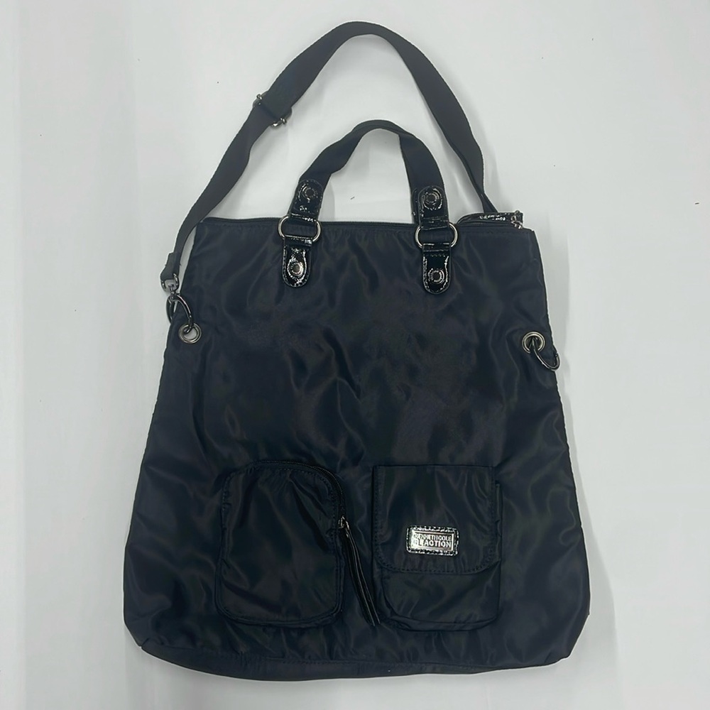 Kenneth Cole Reaction crossbody purse in black nylon material, adjustable strap.